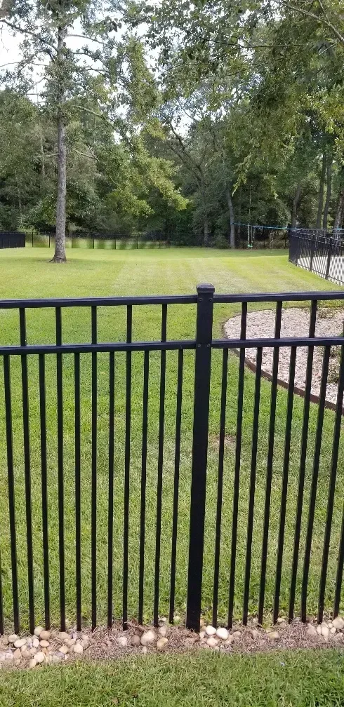 Residential fence installation before and after in Baldwin County by Mitchell Fence Company