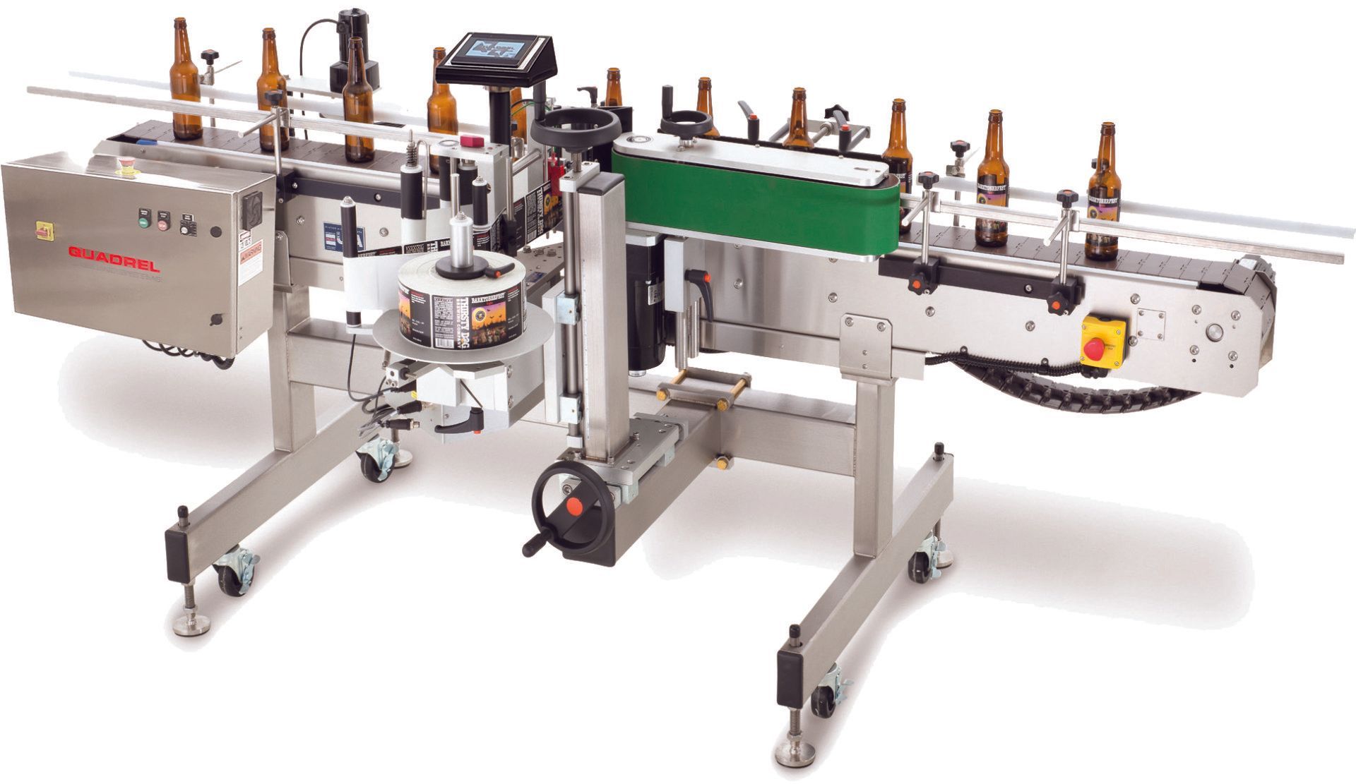 An industrial labeling machine with a conveyor system applying labels to glass bottles.