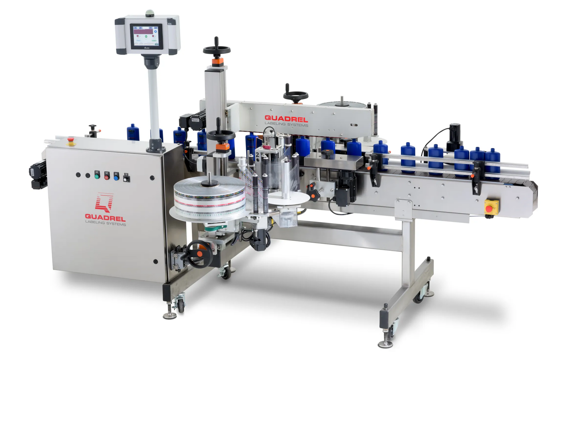 An industrial labeling machine with a large roll of labels.