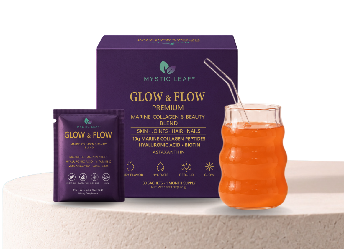 Purple Glow & Flow tea boxes beside an orange drink in a glass on a light surface