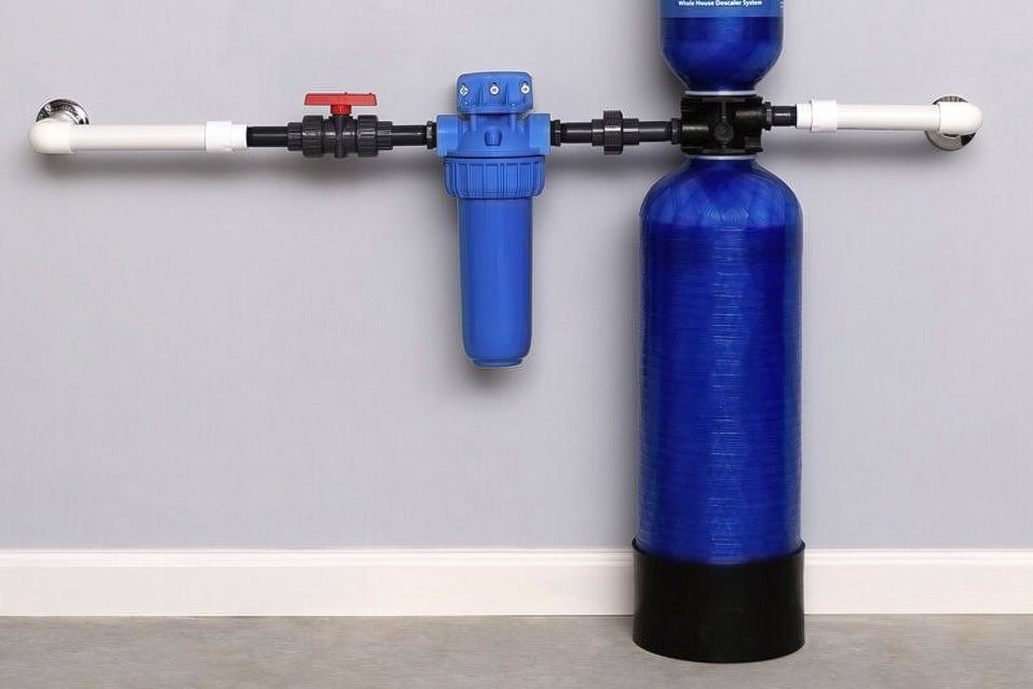 Blue water filtration system with tank, canister, and pipes mounted on a wall