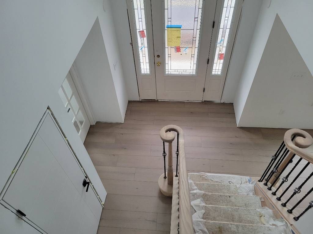 An aerial view of a foyer with new flooring by Floor Source