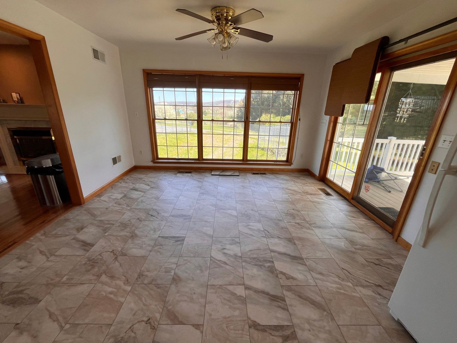 An empty room with new flooring by Floor Source