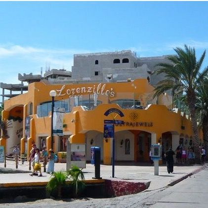 a large orange building with lorenzillo 's written on it