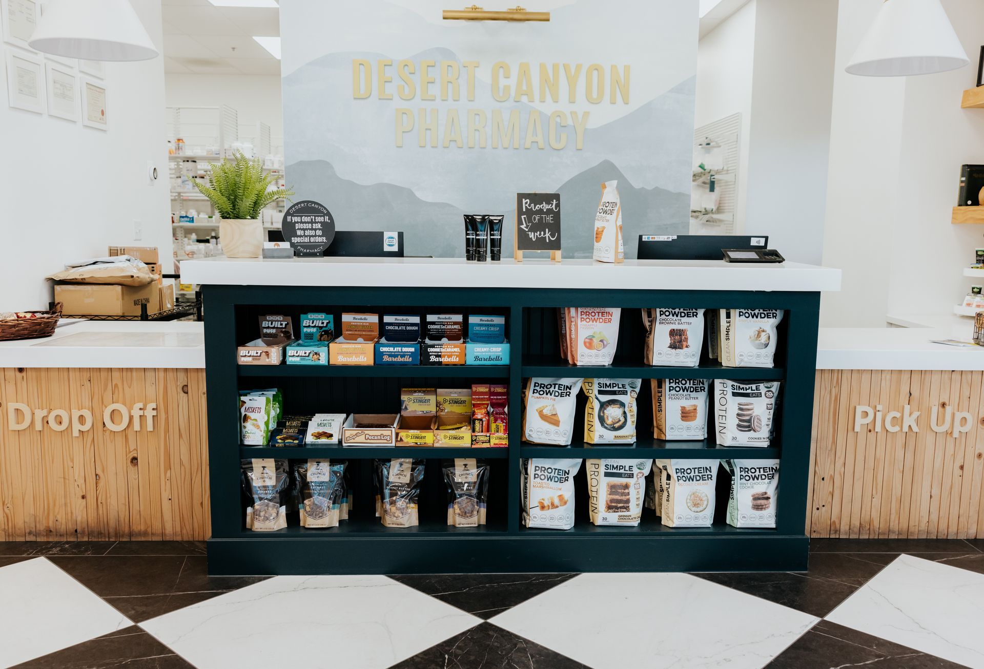 Interior of Desert Canyon Pharmacy with merchandise display and pickup counter.