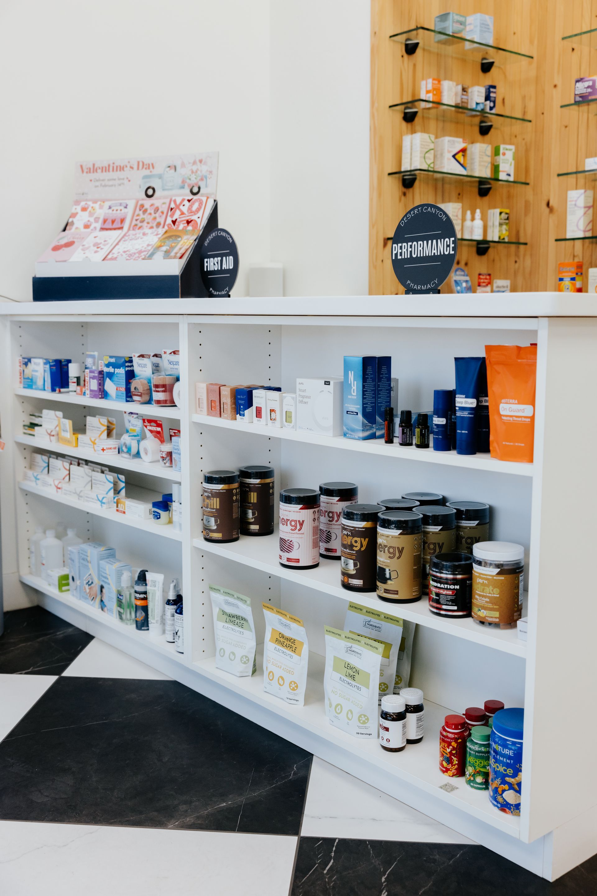 Pharmacy display with shelves of medications and supplements.