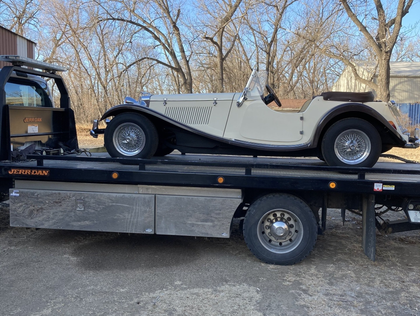 hauling a car on freeway- towing service in Williston, ND