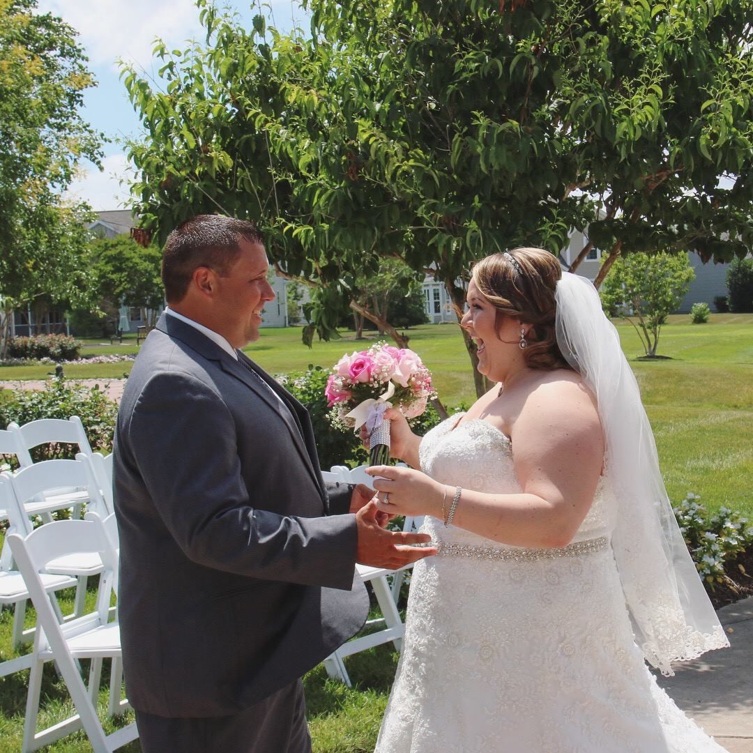 bride and groom smiling at each other
