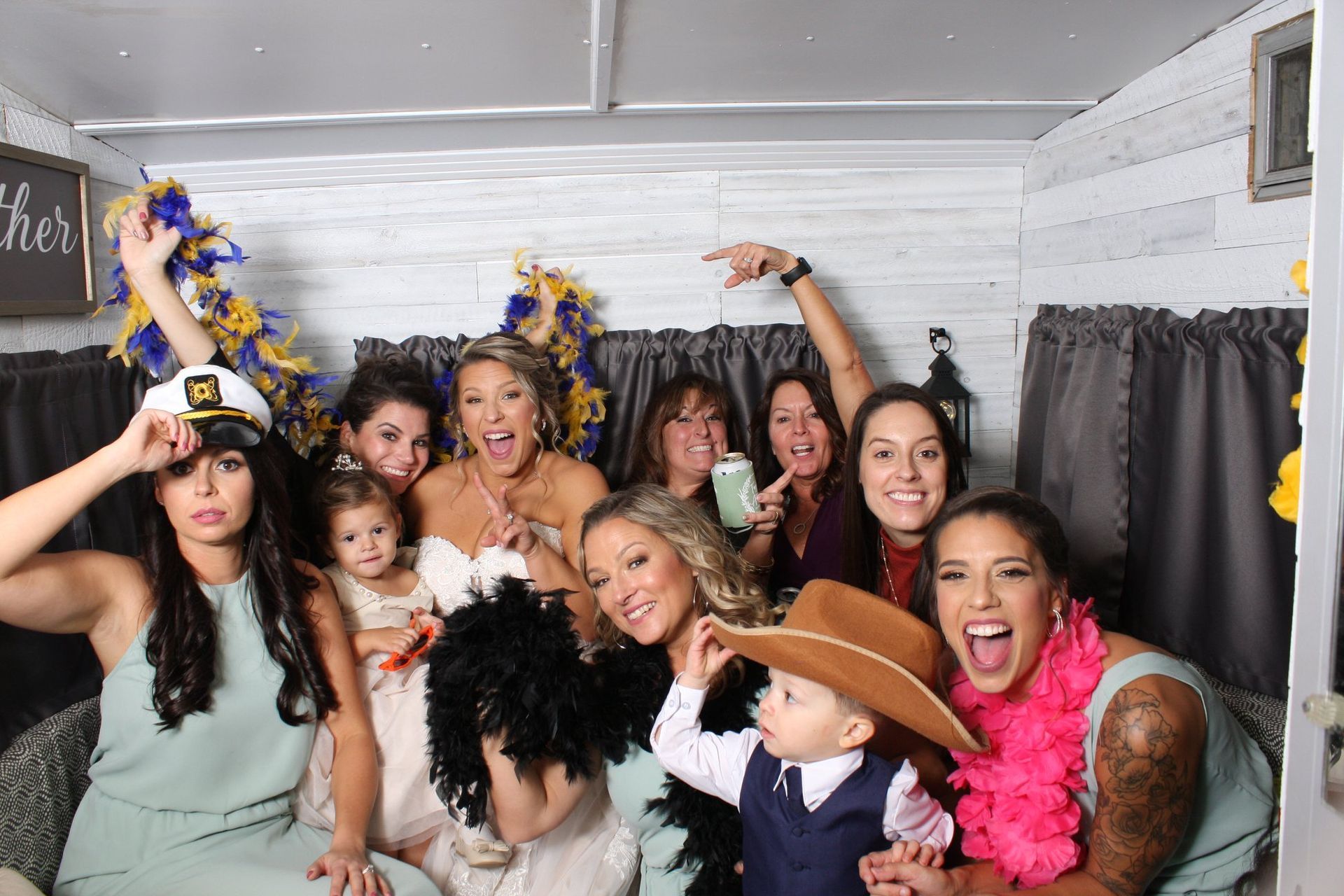 wedding guests posing with props in photo booth