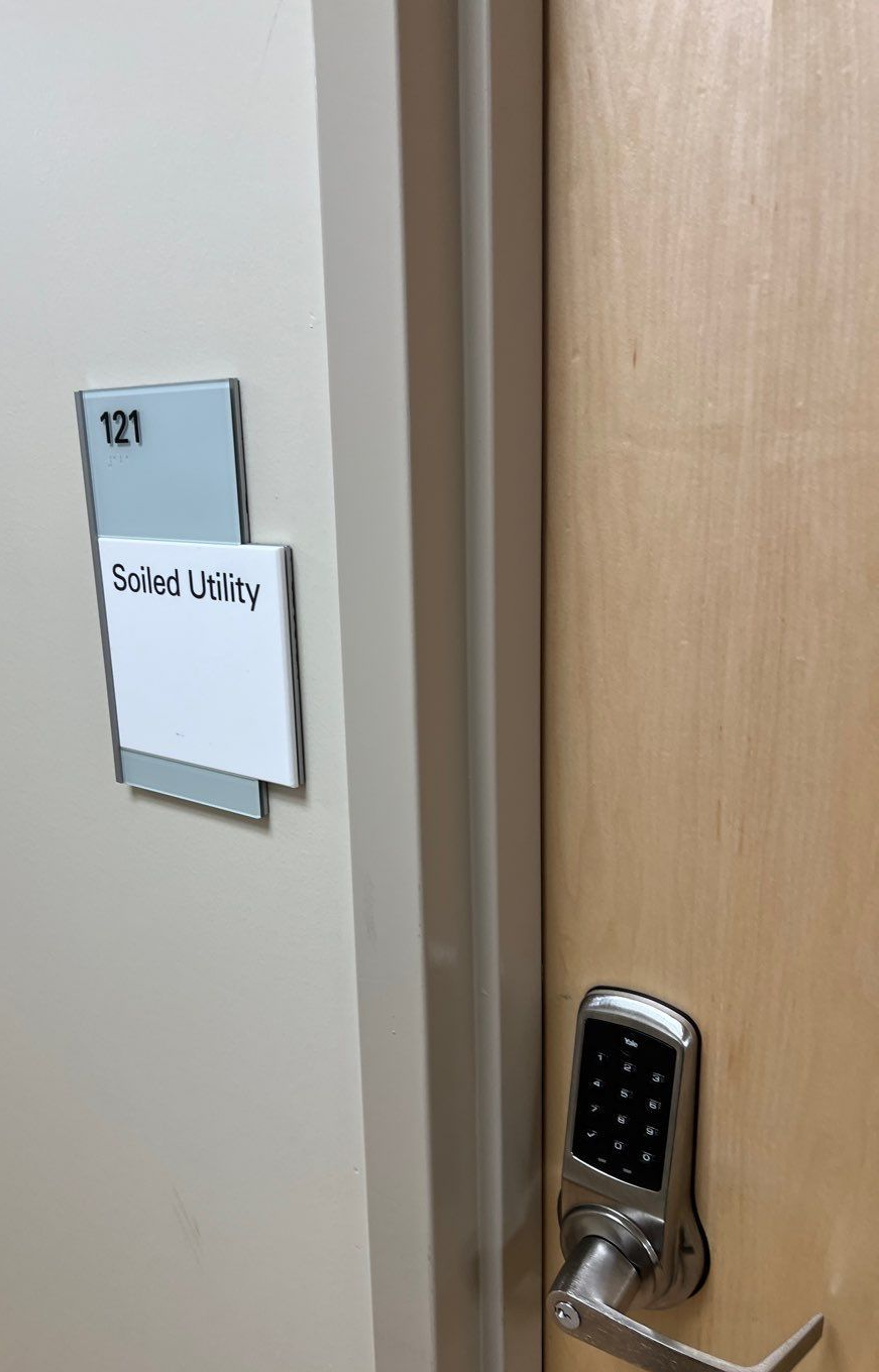 Door with a keypad lock and a sign that reads
