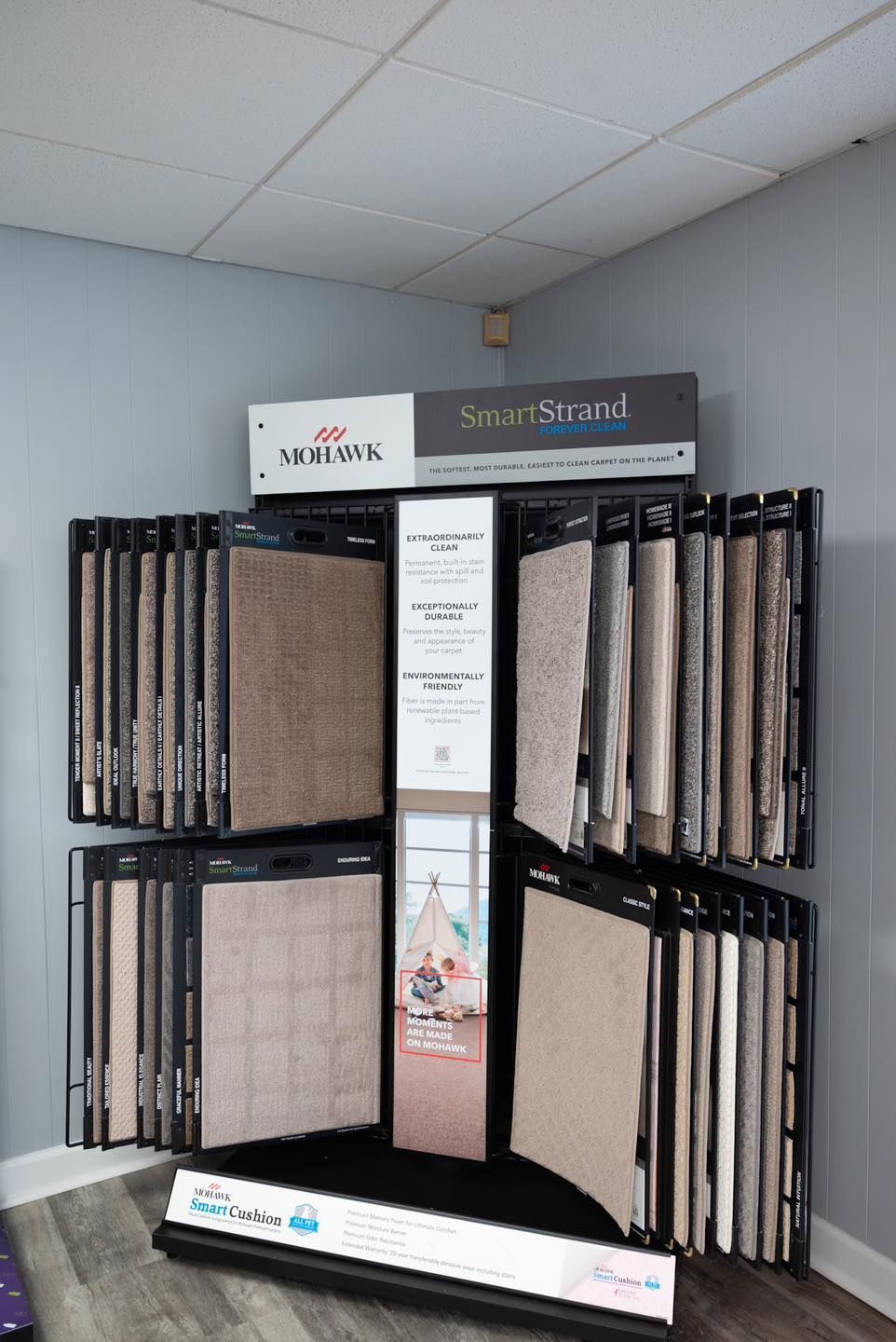 Carpet samples displayed on a rack in a retail store.
