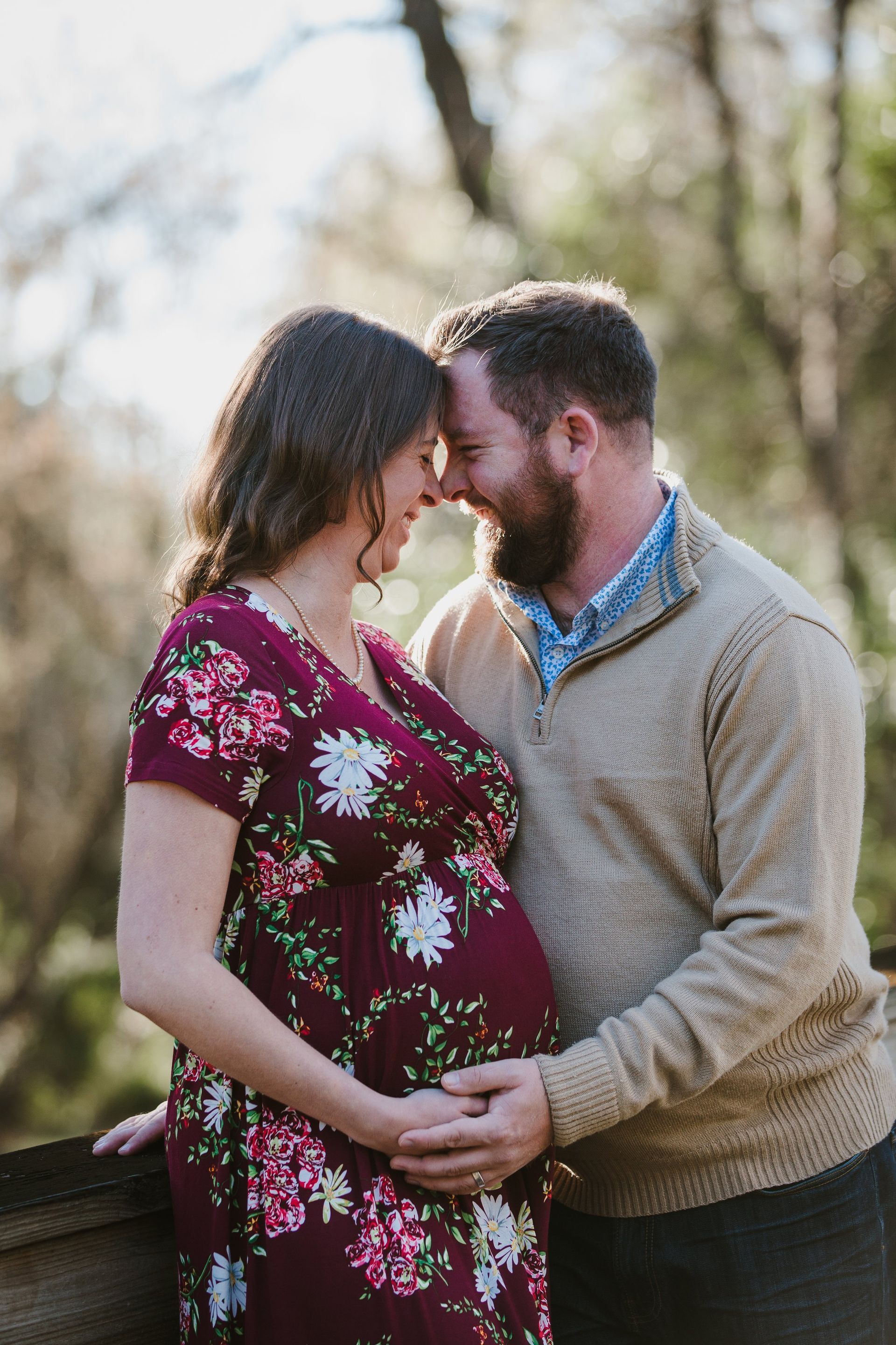 A man and a pregnant woman are looking at each other.