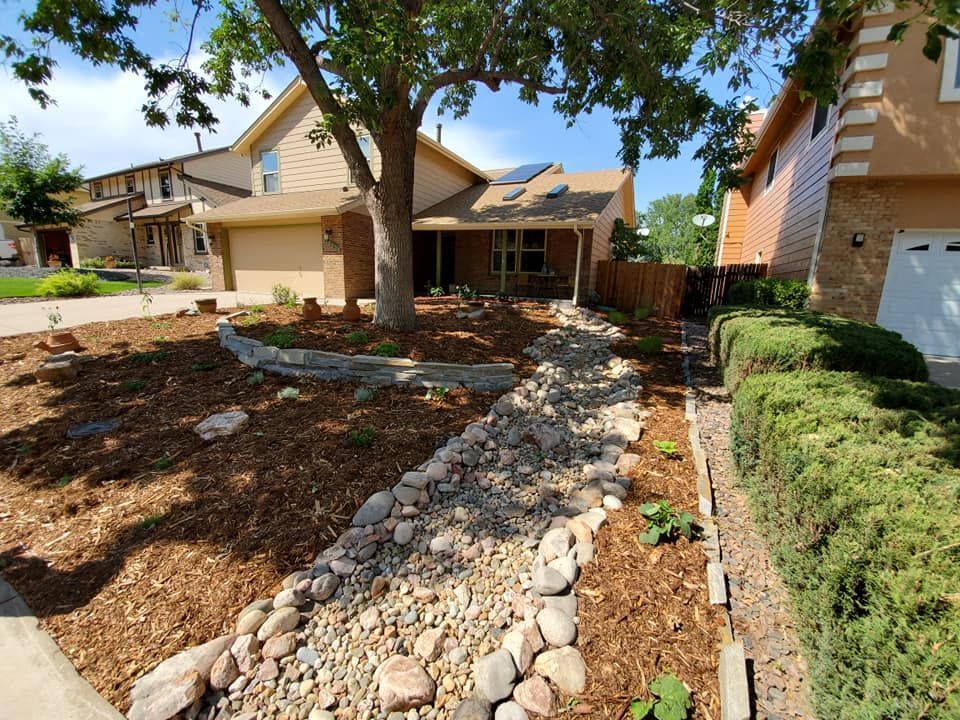 A house with a stone walkway leading to it
