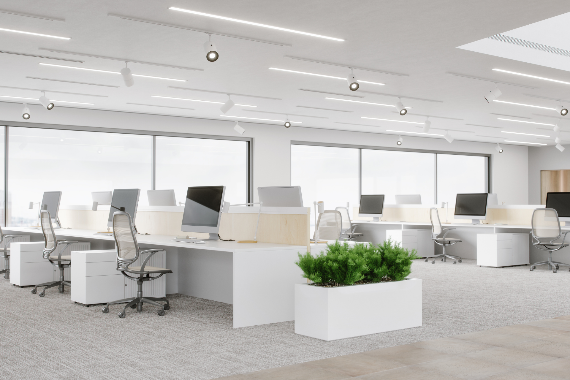 Team members high-fiving in a bright office, smiling during a collaborative meeting.