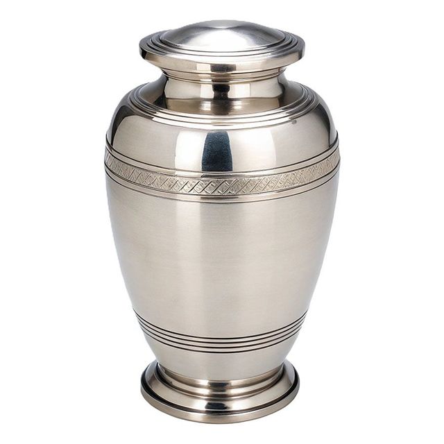 Silver urn with engraved bands and a domed lid on a white background