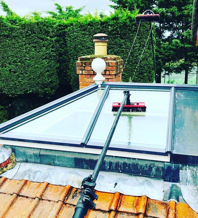 white brick and upvc conservatory at rear of house