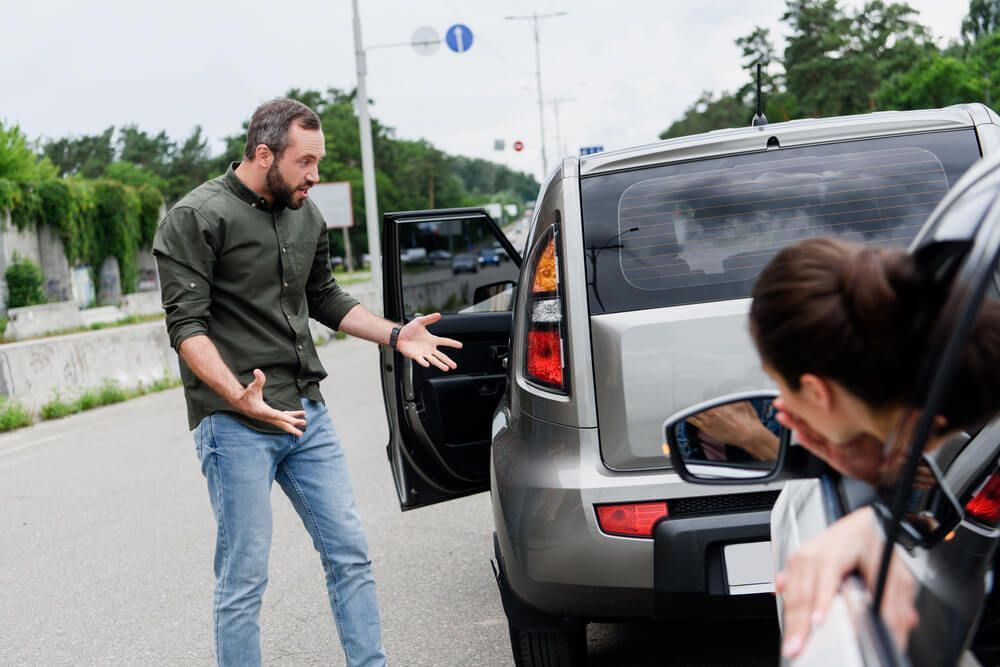 How does fault impact settlement values for whiplash injuries?