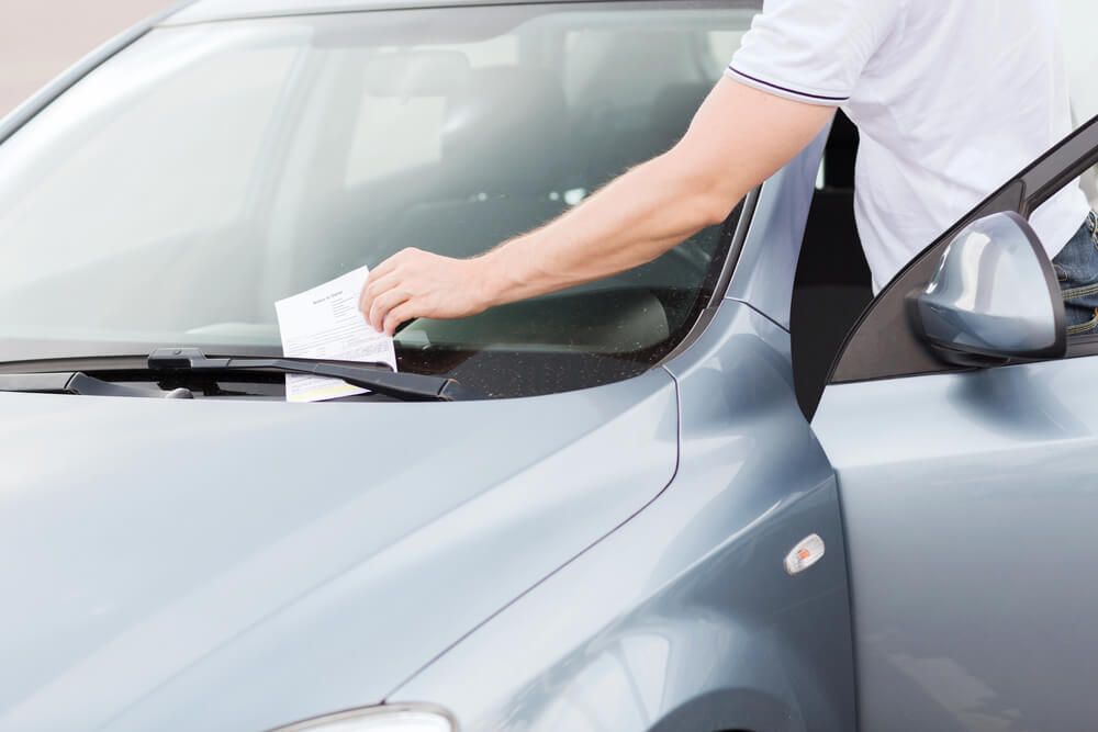 What do I do if someone left a note after my car was hit while parked on the street?