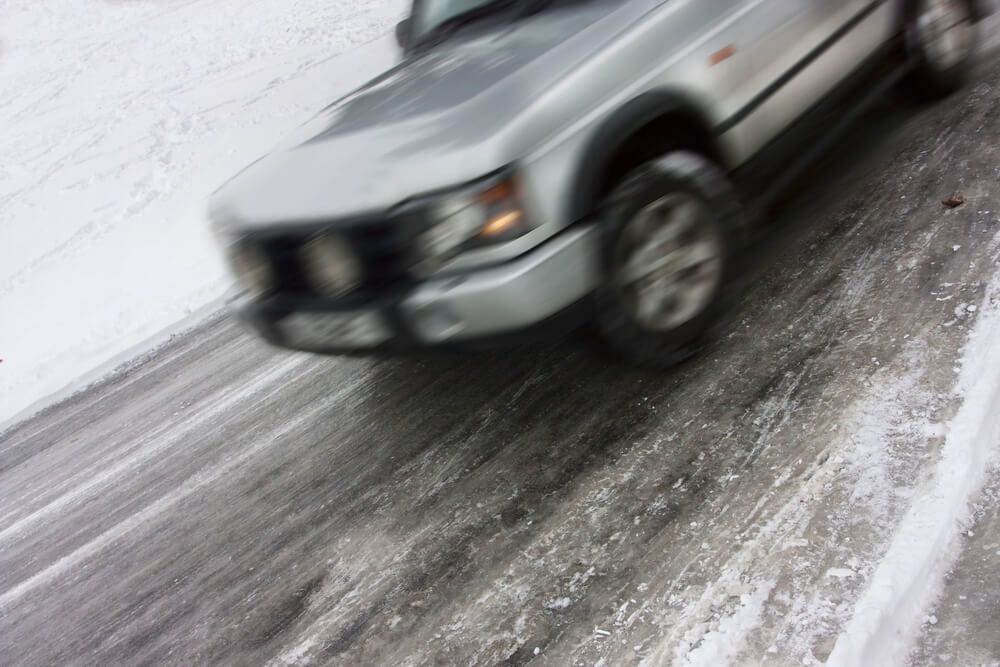 How is black ice accident fault determined?