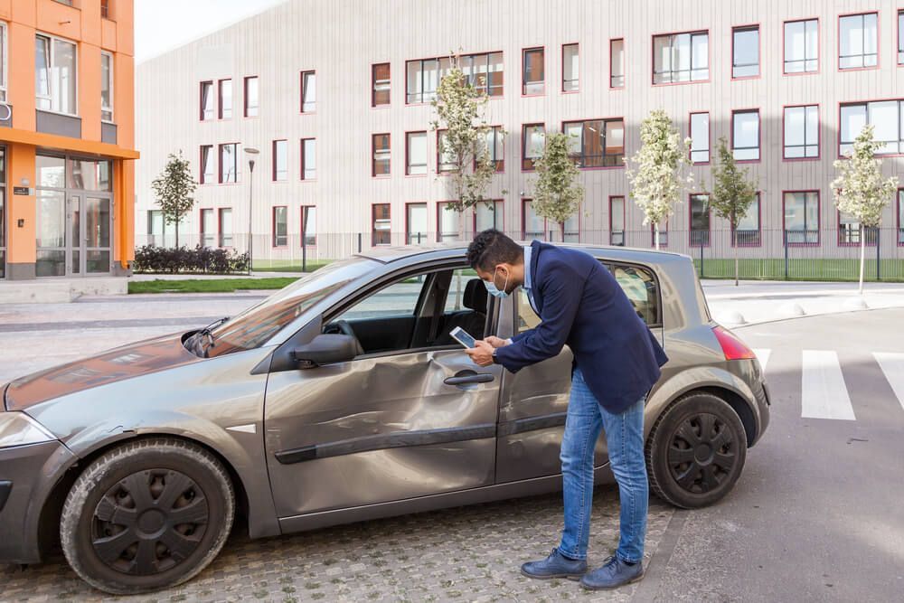 What happens if my car is hit while parked on the street?