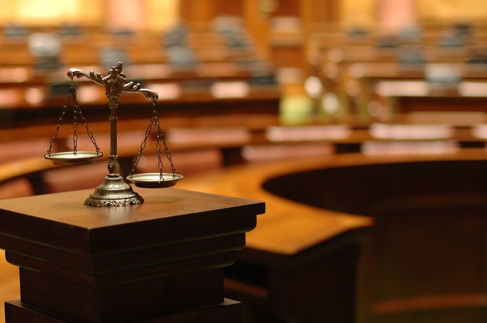 an empty court room because a lawyer wanted to settle out of court