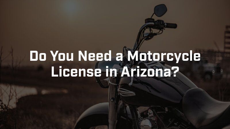 A motorcycle sits parked outdoors at sunset with the text,