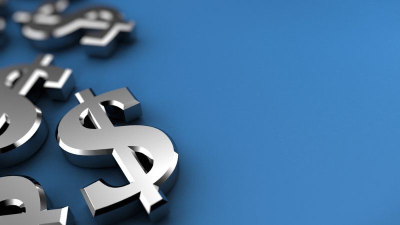 Shiny, metallic dollar signs scattered on a vibrant blue background.