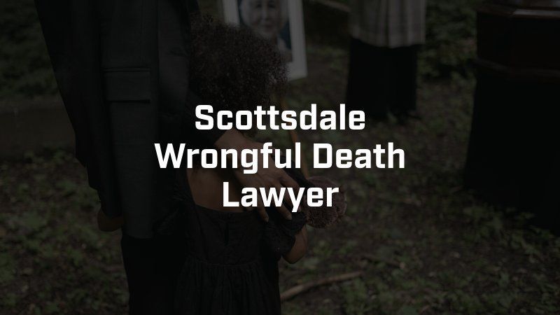 A person holding a child at a funeral with the text