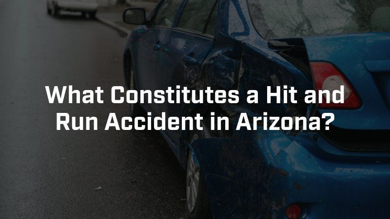 A damaged blue car parked on a road with the text overlay: