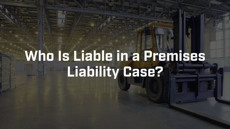 A warehouse with a parked yellow forklift with the overlay text: Who Is Liable in a Premises Liability Case?