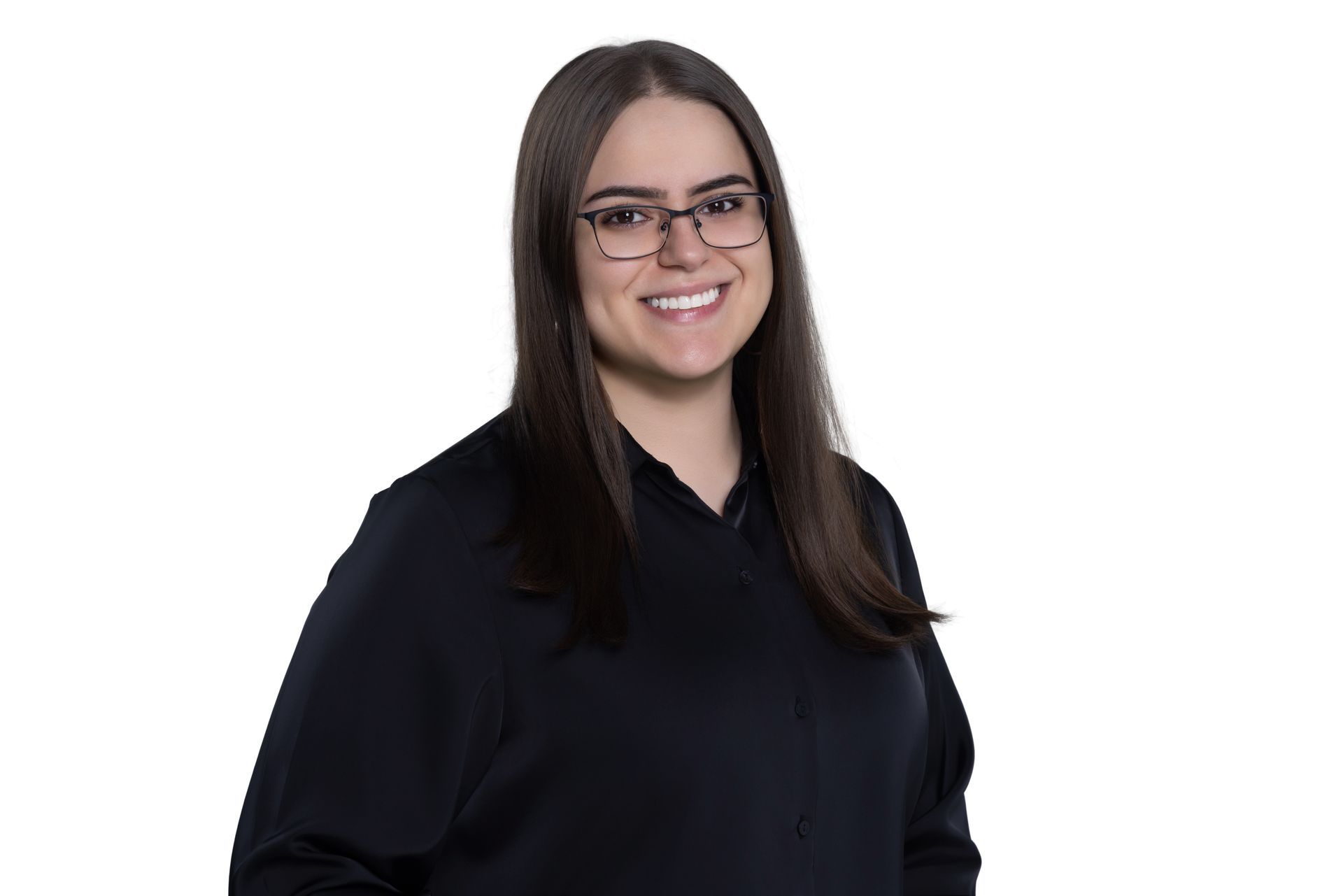 A person with long brown hair and glasses wearing a black shirt, smiling against a white background.