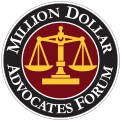 The logo for the million dollar advocates forum is a scale of justice in a circle.