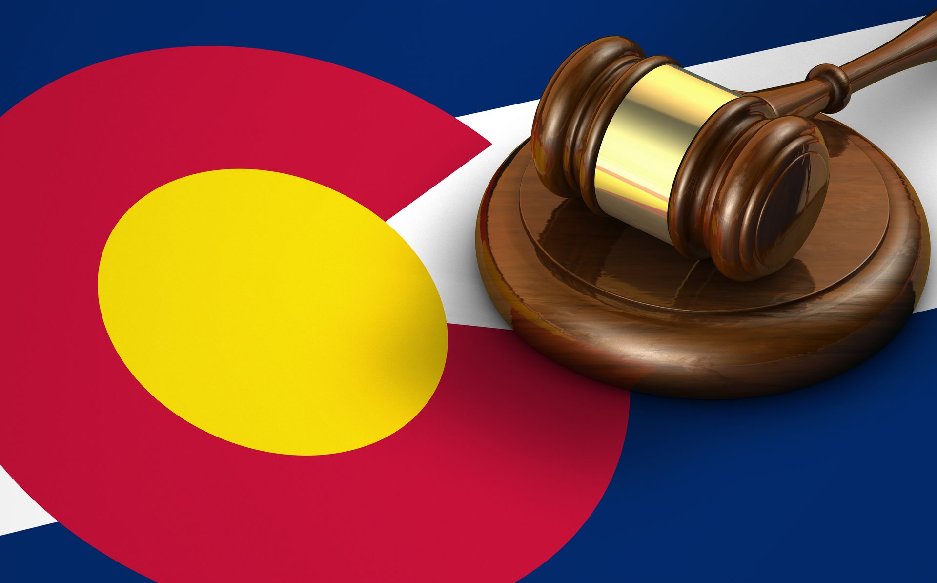 Colorado flag with a gavel, symbolizing the state's legal system.