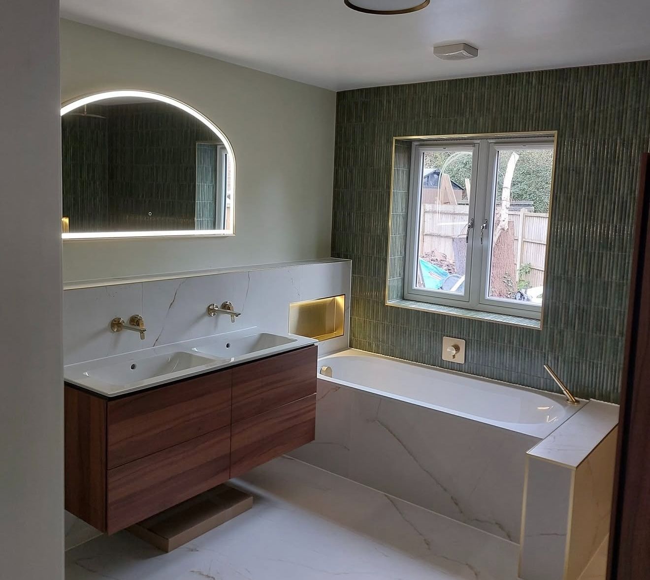 High-end finished bathroom with feature lighting