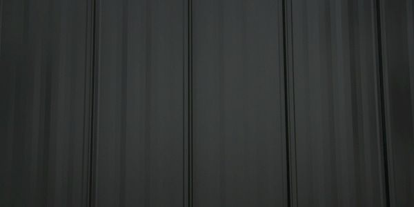 Dark gray metal roof shingles