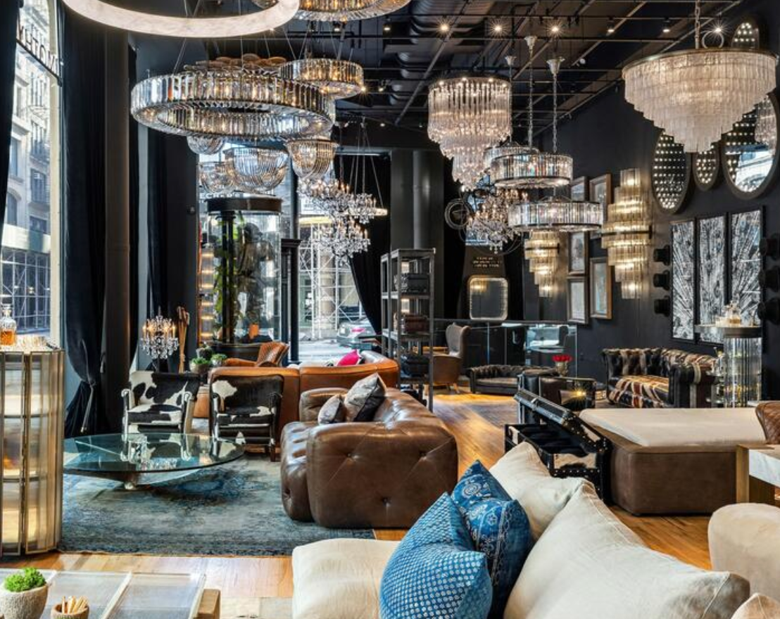 a living room with a lot of furniture and chandeliers