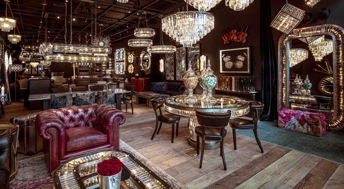 a living room filled with furniture and chandeliers .