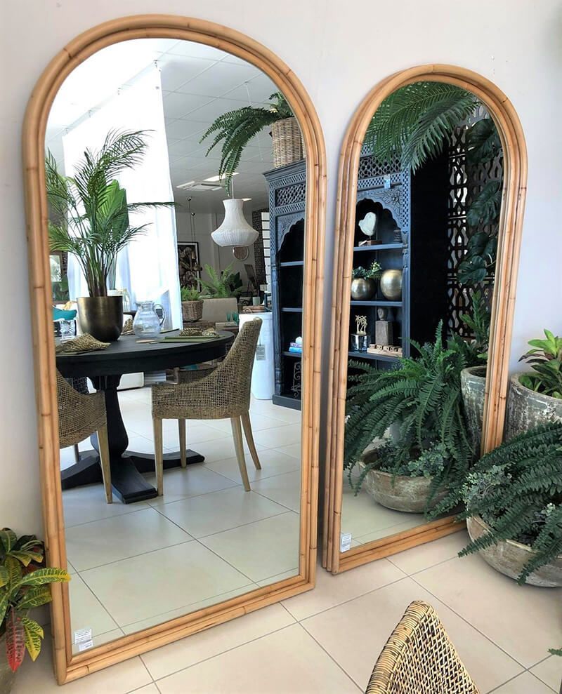 Two Tall Wooden-framed Mirrors in a Bright Room With Plants and a Table Reflected in the Left Mirror — Tropic Living in Smithfield, QLD