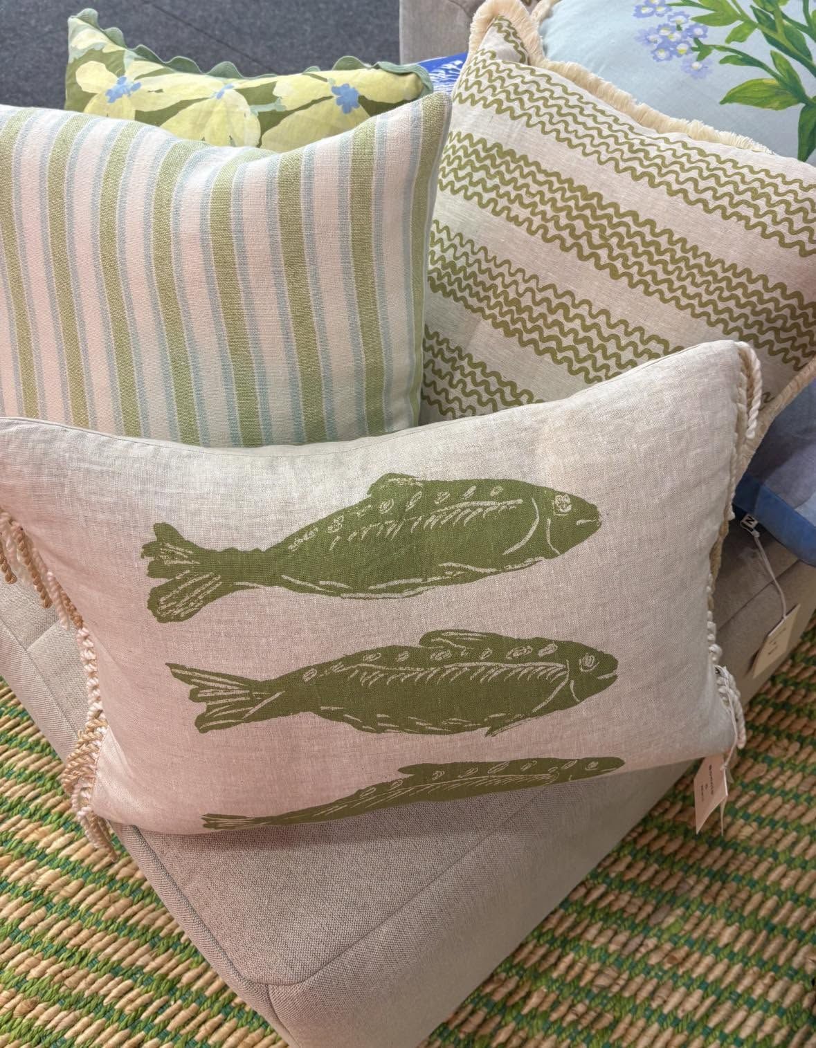 Decorative Throw Pillows With Fish and Striped Patterns on a Woven Couch — Tropic Living in Smithfield, QLD