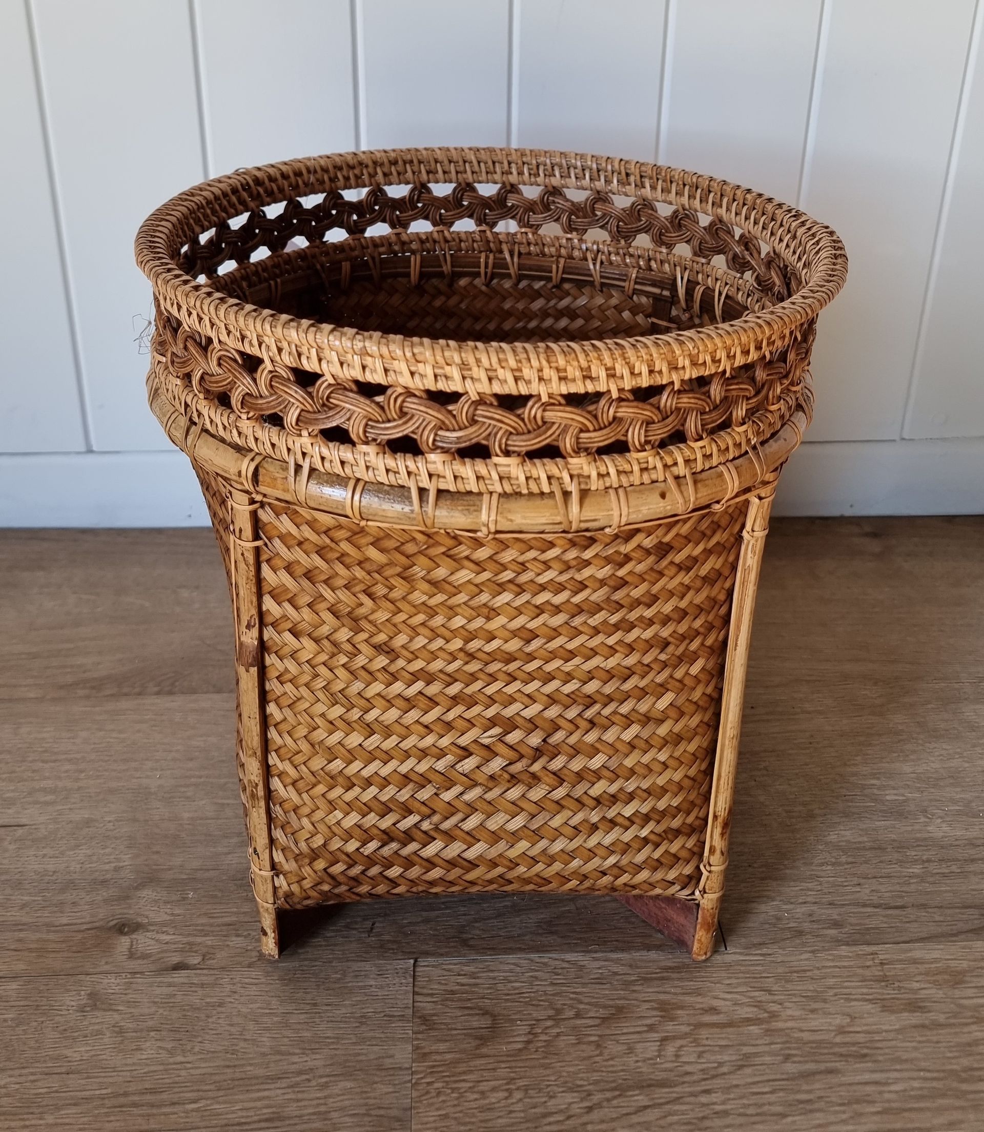 Woven Rattan Basket Planter With Decorative Trim, Standing on a Wooden Floor Against a White Wall — Tropic Living in Smithfield, QLD