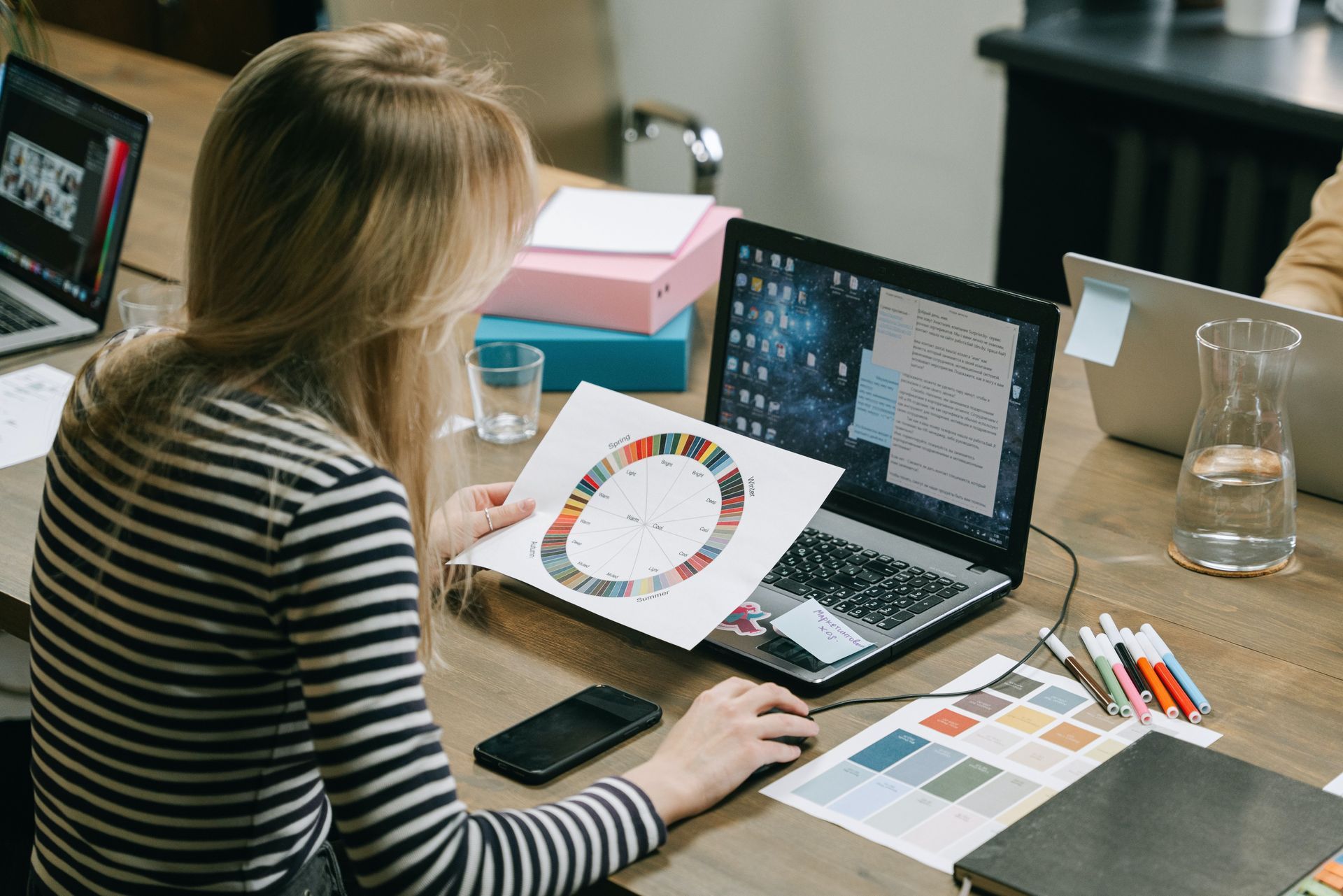 graphic designer selecting colors for a brand using psychology