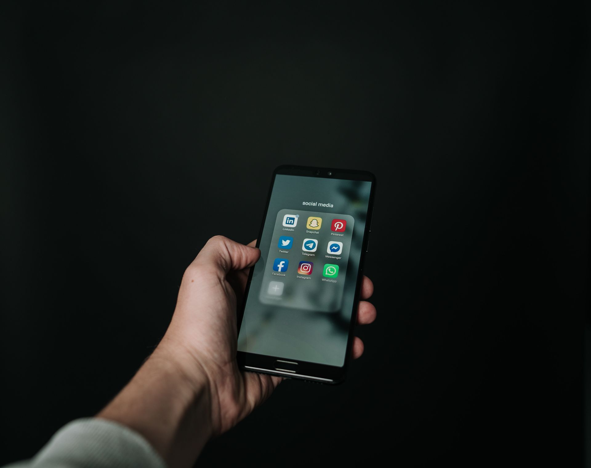 person using cell phone to connect on social media