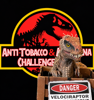 Toy velociraptor in a box before a Jurassic Park-style anti-tobacco challenge logo on black background