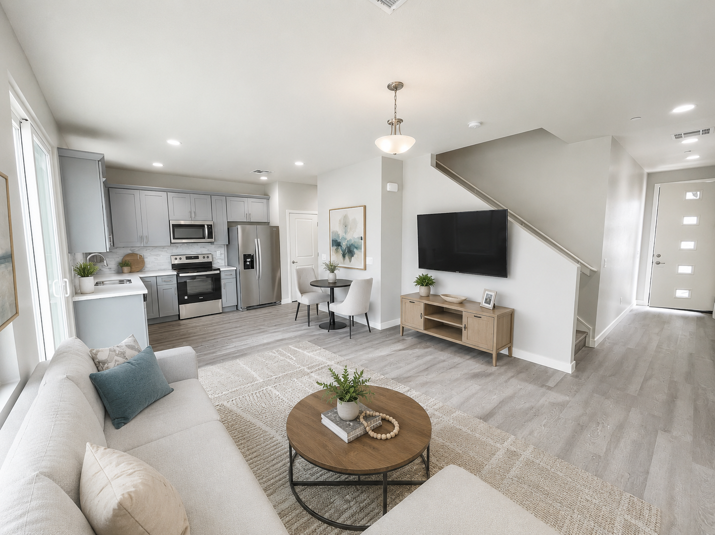 Furnished apartment living area shown — representative home at Stone View on Central.