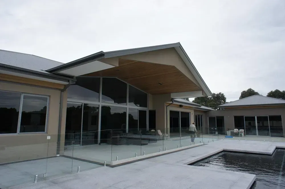 A Large House with a Lot of Windows and a Pool | Warragul, VIC | ADI Building Services