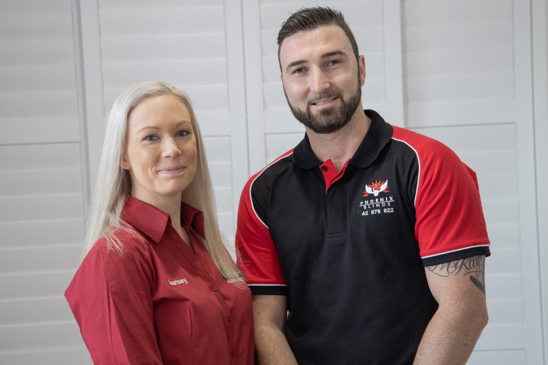 Two people in uniform posing for a photo — Phoenix Blinds In Albion Park Rail, NSW
