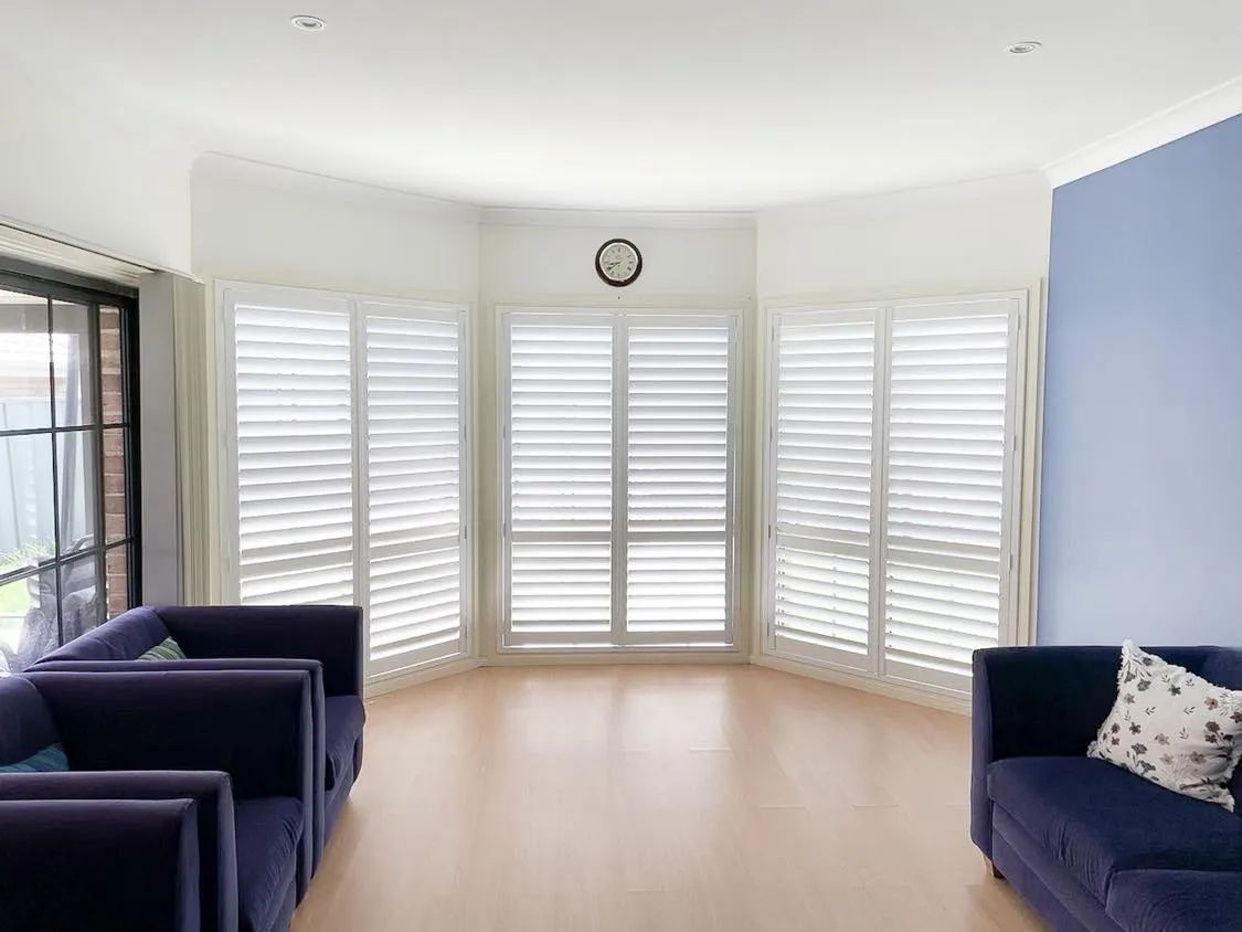 Cozy Room Featuring Three Large Blinds