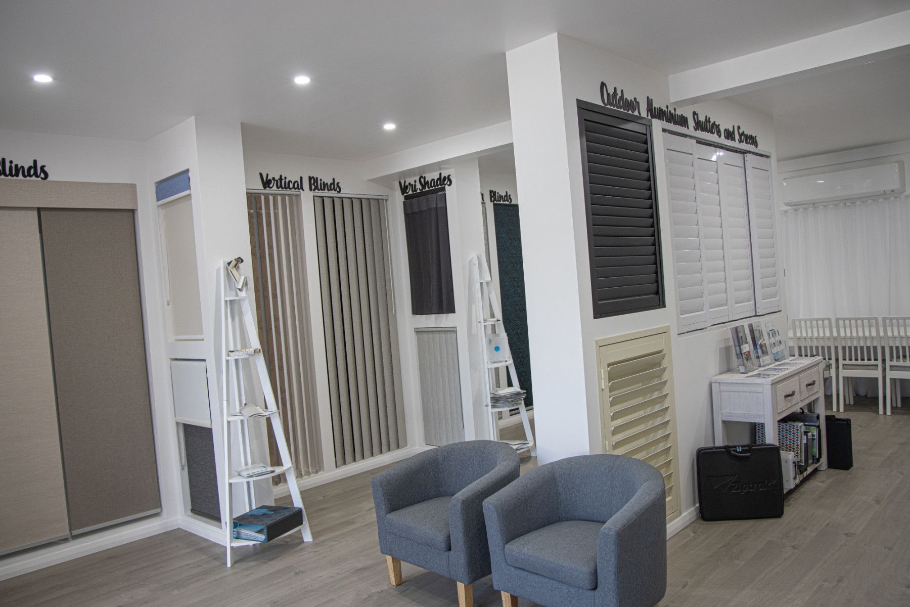 A Kitchen with A Dining Table and Chairs in It — Phoenix Blinds In Albion Park Rail, NSW