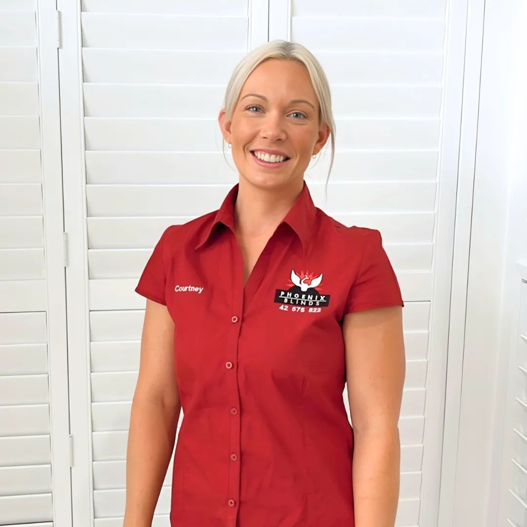 A Woman Wearing a Red Shirt with A Logo on It — Phoenix Blinds In Albion Park Rail, NSW