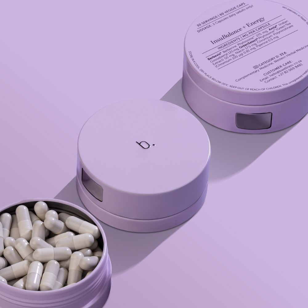 Three light purple, cylindrical containers on a matching background, one open revealing white capsules.